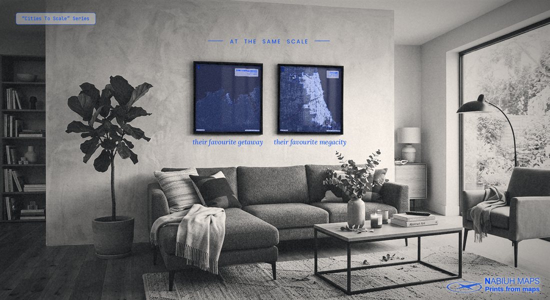 Two framed Cities To Scale prints — a small town and Chicago at the same physical scale — hung side by side in a living room, captioned "their favourite getaway" and "their favourite megacity."
